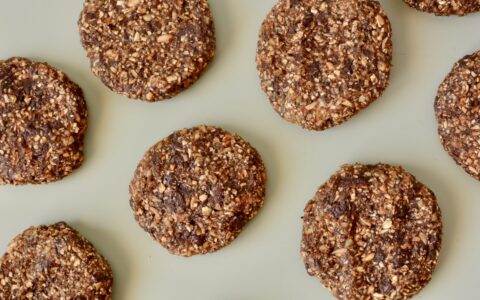 a photo of freshly baked oatmeal cookies on a green ground